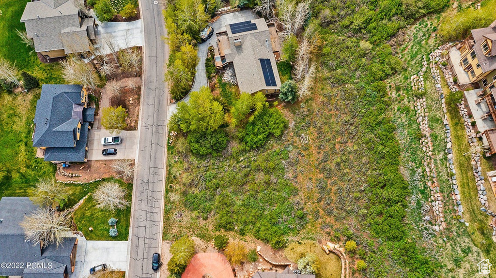 Aerial overview of property's location with nearby suburban area