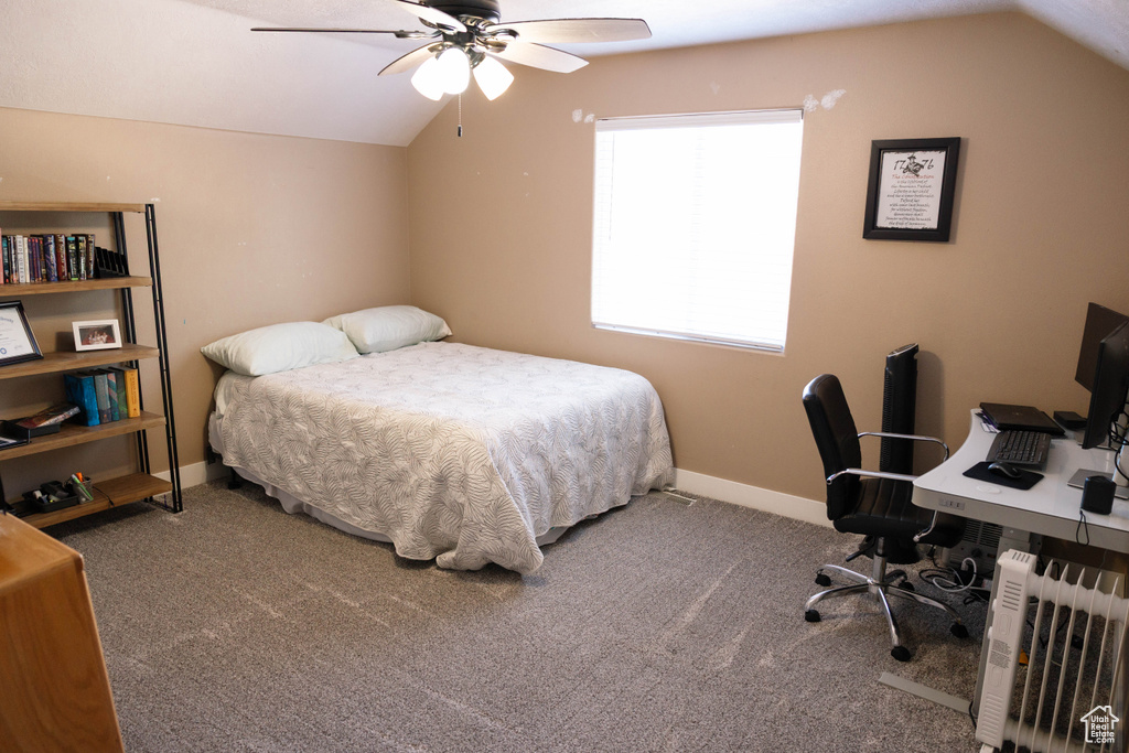 Bedroom with lofted ceiling, carpet floors, an office area, and ceiling fan