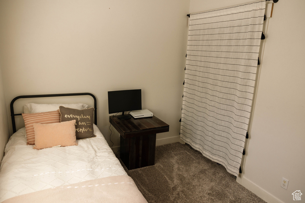 Bedroom with carpet and baseboards