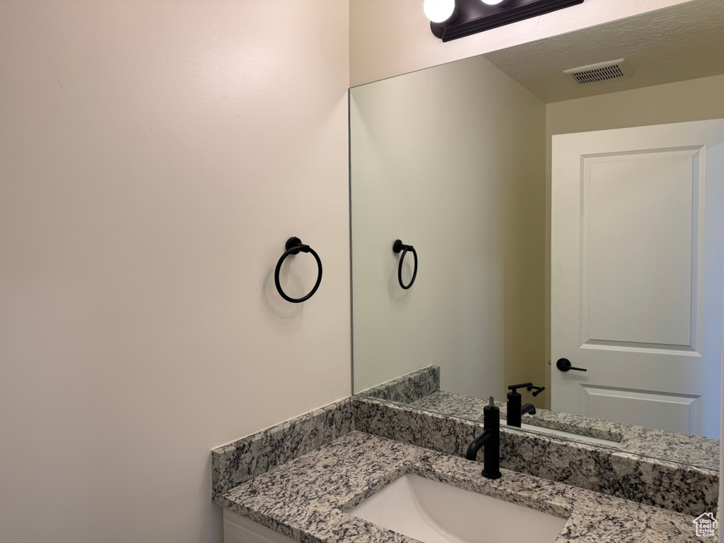 Bathroom featuring vanity