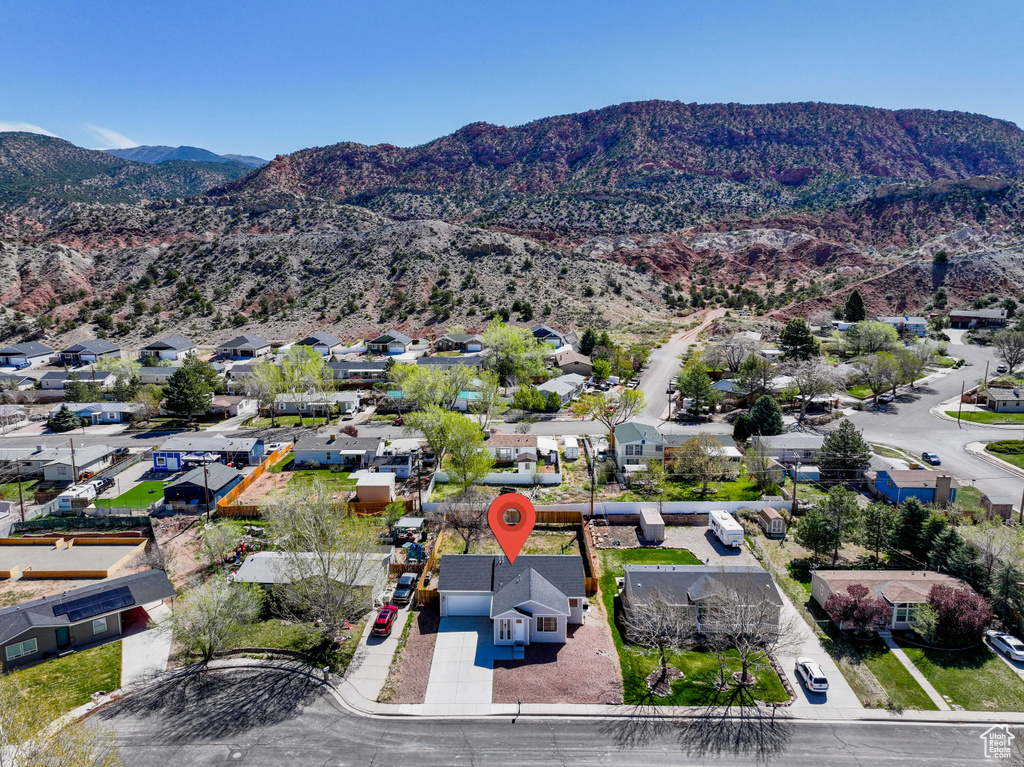 Aerial view of residential area featuring a mountainous background