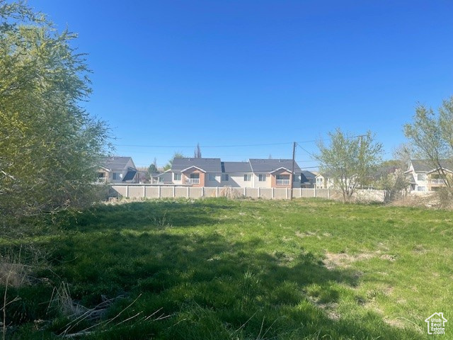 View of yard featuring fence