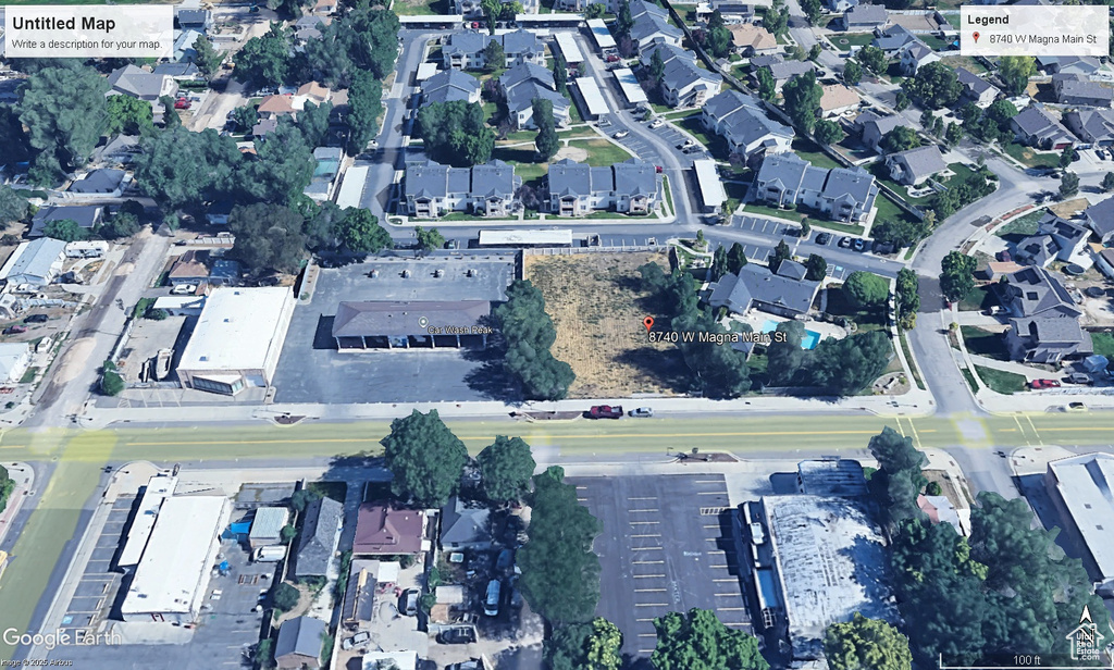 Aerial view of property and surrounding area featuring nearby suburban area