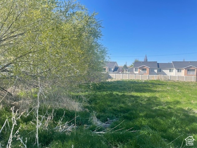 View of yard featuring fence