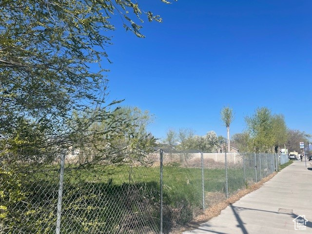 View of home\\\'s community featuring fence