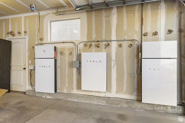 Garage featuring freestanding refrigerator