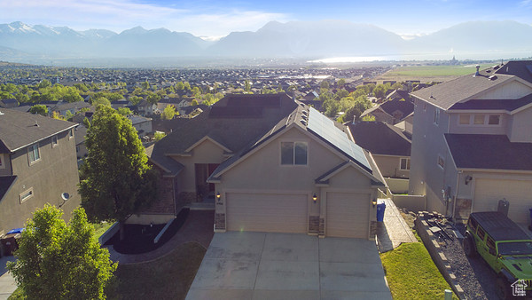 Aerial perspective of suburban area with a mountain backdrop