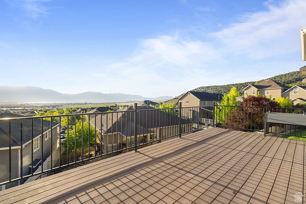 Deck featuring a residential view and a mountain view