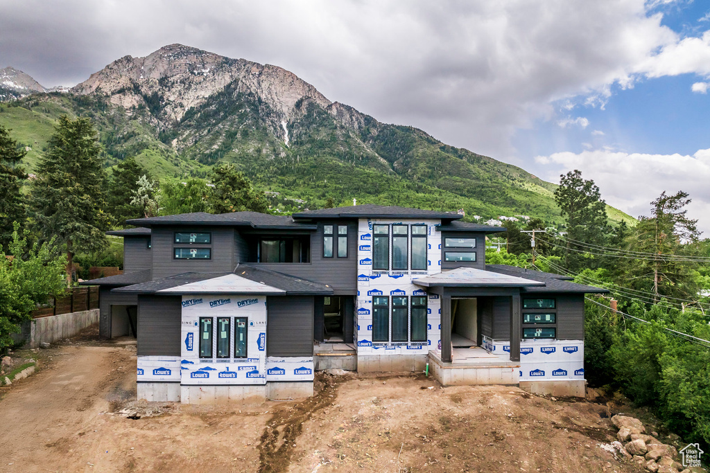 View of front of home featuring a mountain view
