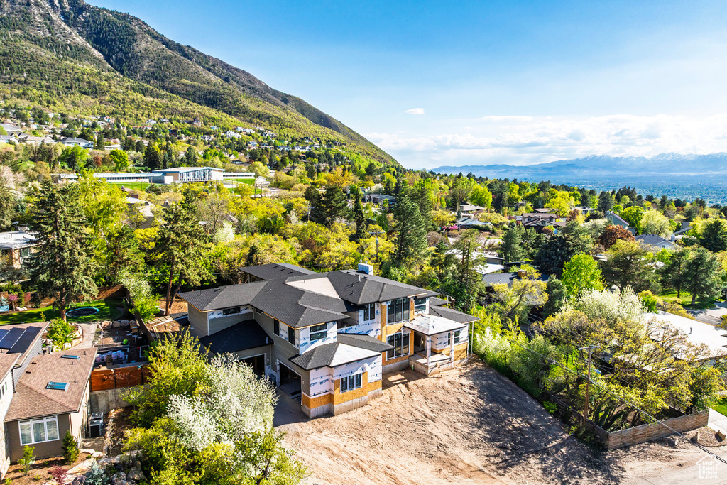 Birds eye view of property with a residential view and a mountain view