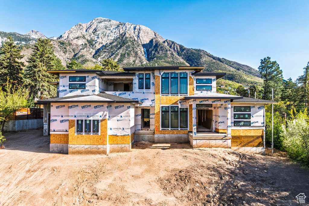 Property under construction with a mountain view