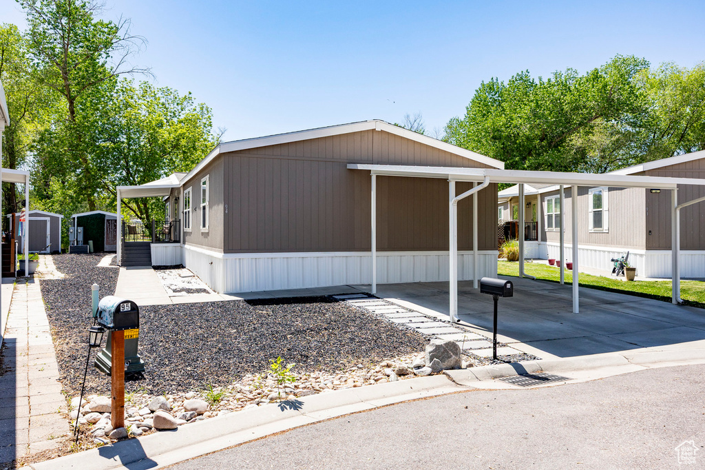 Manufactured / mobile home with a storage shed and an outdoor structure