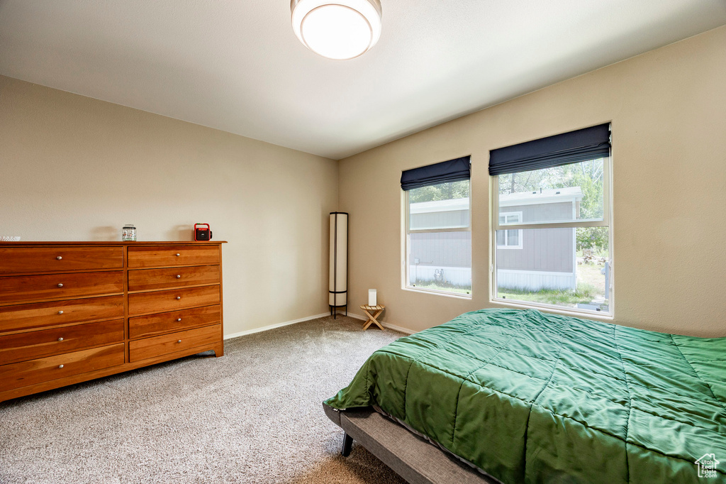 Carpeted bedroom with baseboards