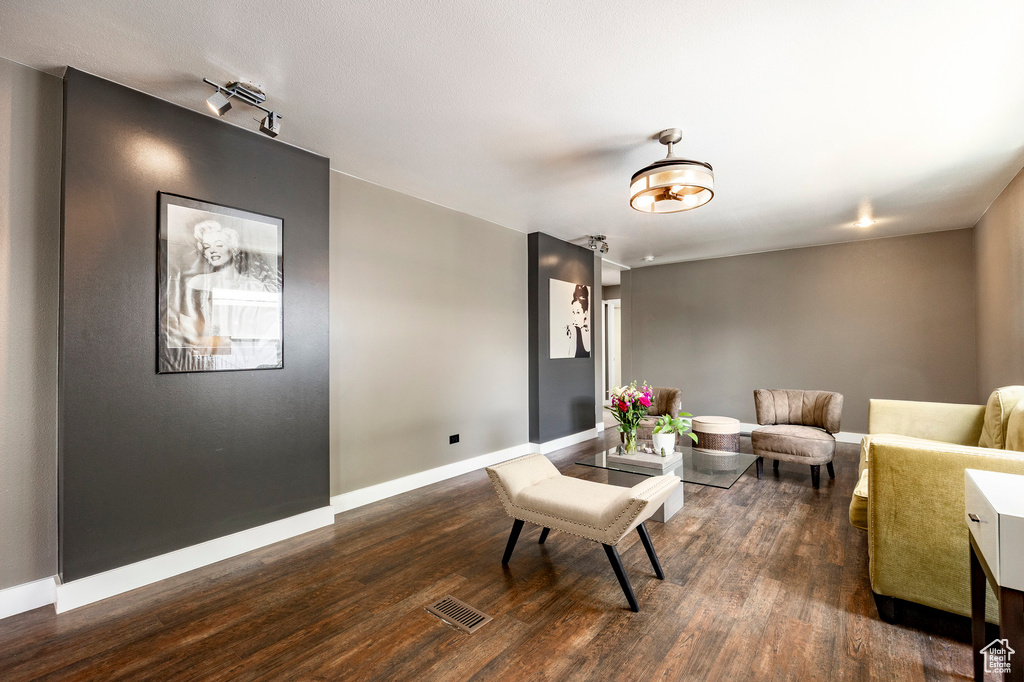 Living room featuring wood finished floors and baseboards