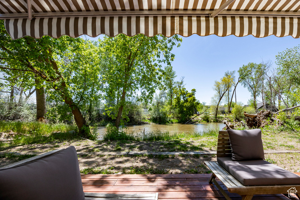 Wooden terrace featuring a water view