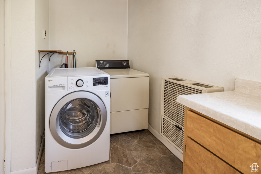 Laundry room featuring washing machine and dryer