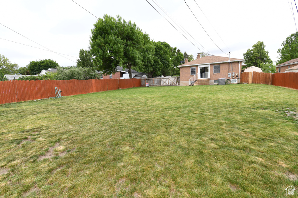 View of yard with central AC