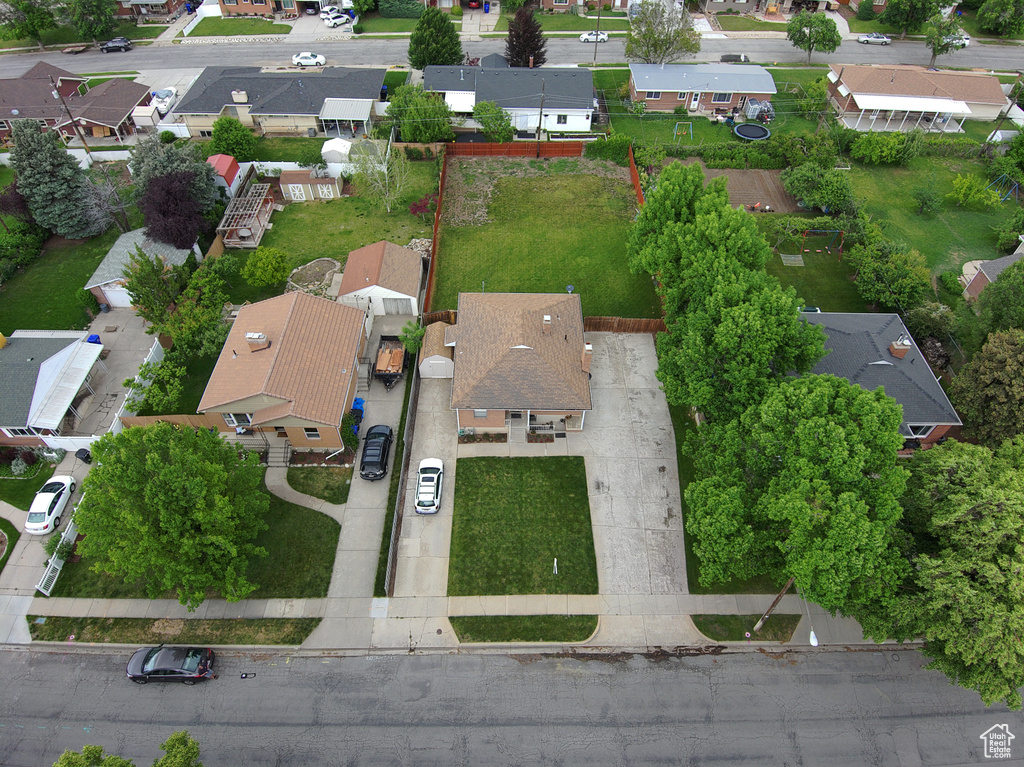 Aerial view of property and surrounding area with nearby suburban area