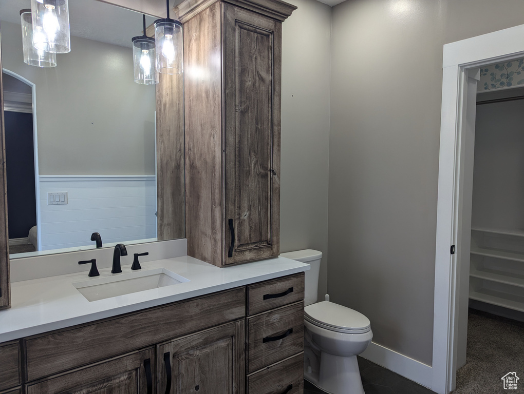 Bathroom with toilet and vanity