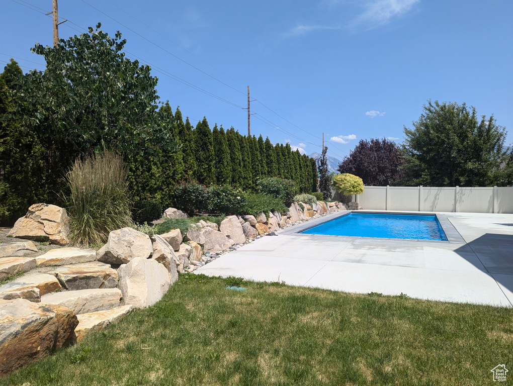 View of swimming pool with a patio area