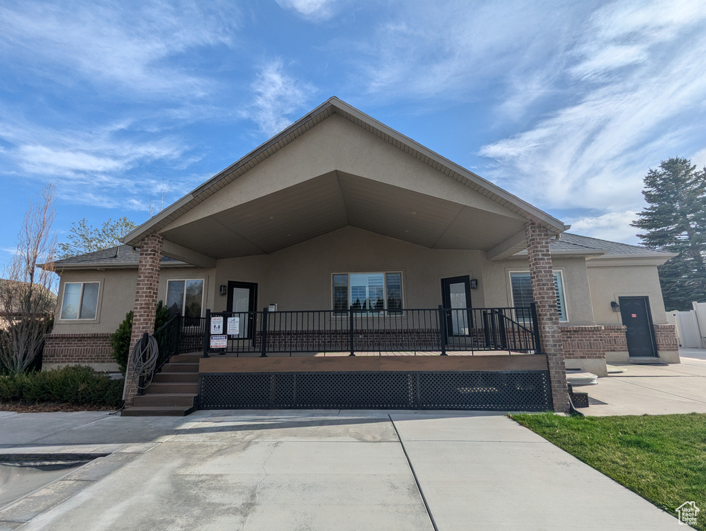 View of front of home with stucco siding and brick siding