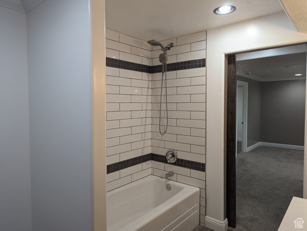 Full bath featuring shower / bathtub combination, recessed lighting, and baseboards