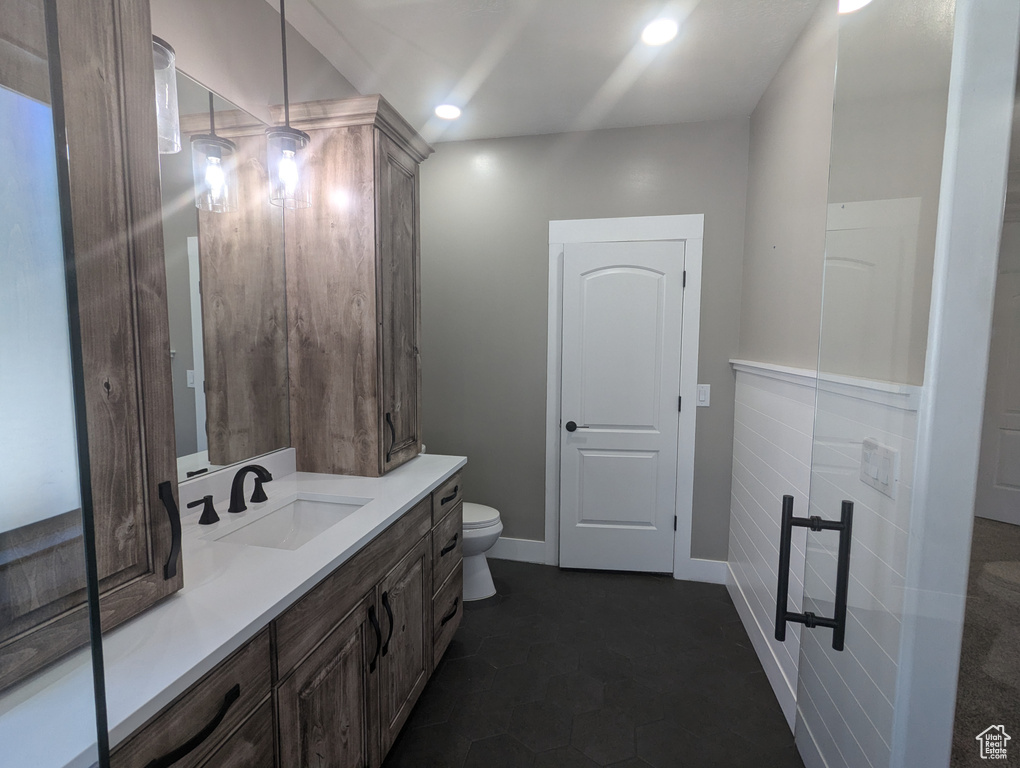 Bathroom with vanity and recessed lighting