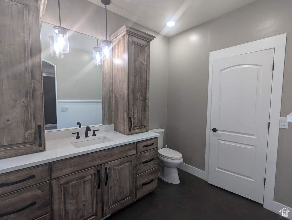 Bathroom featuring vanity and recessed lighting