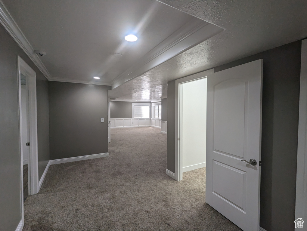 Carpeted spare room with ornamental molding and recessed lighting