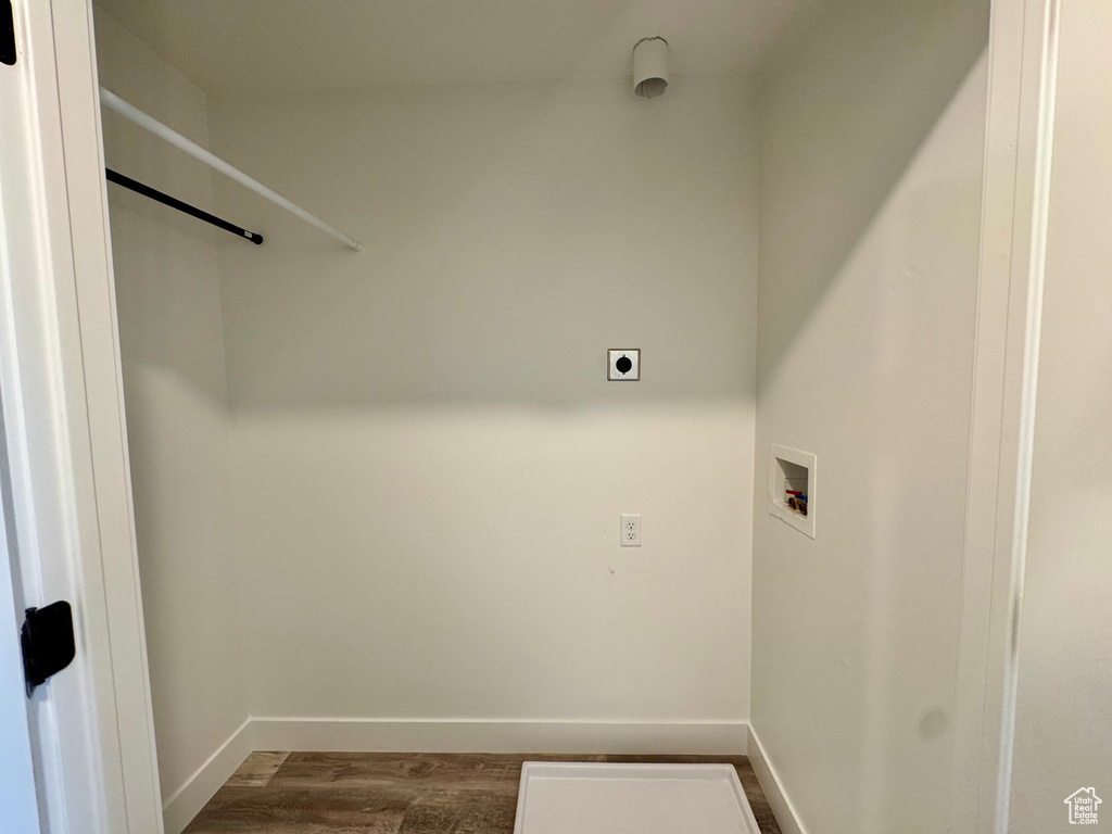 Laundry area with hookup for a washing machine, baseboards, and dark wood-style flooring