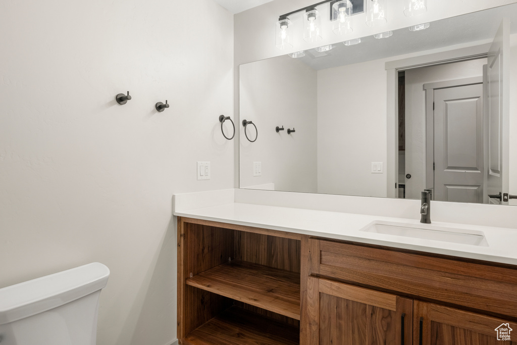 Bathroom with toilet and vanity