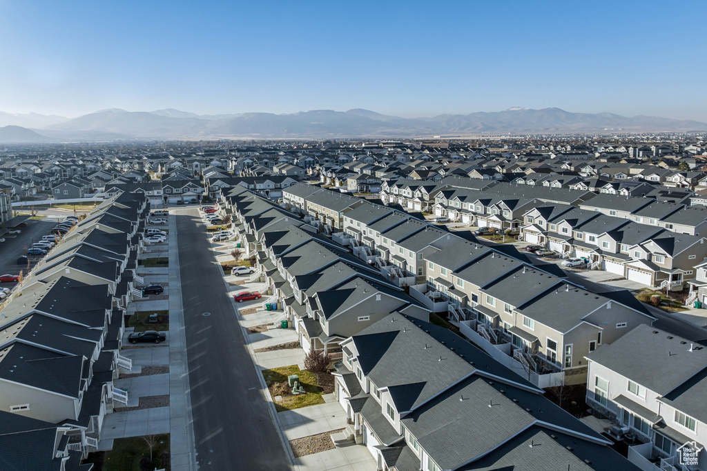 Aerial perspective of suburban area with a mountain backdrop