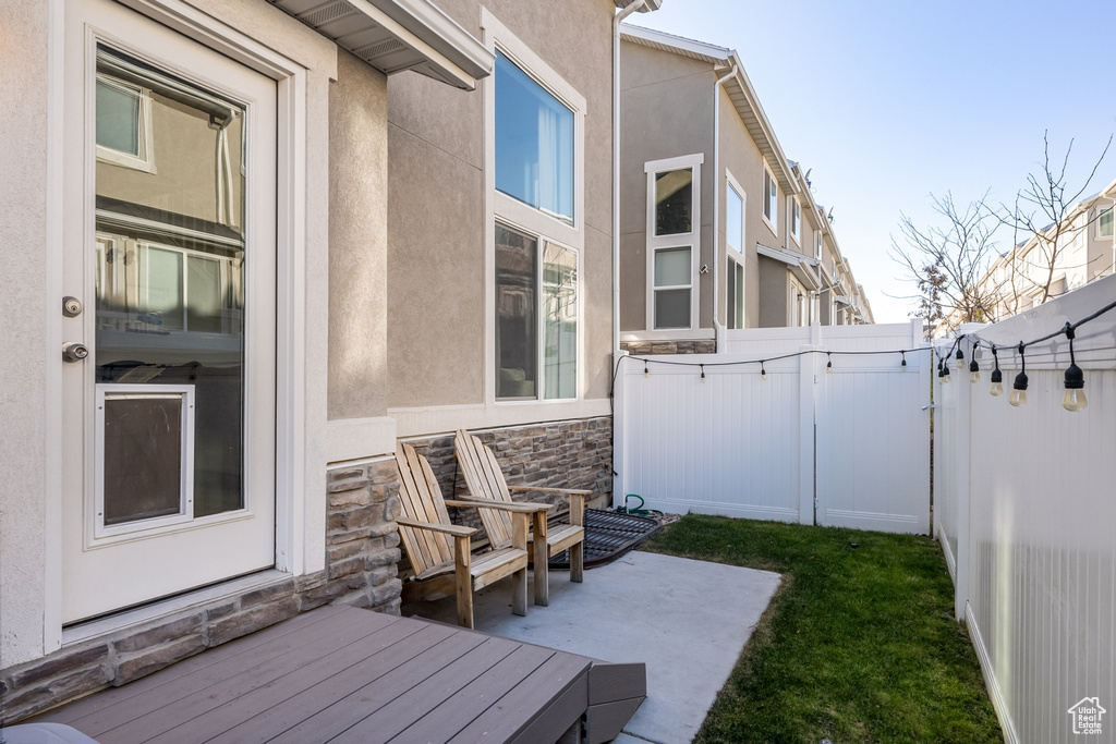 View of patio / terrace with a gate and fence
