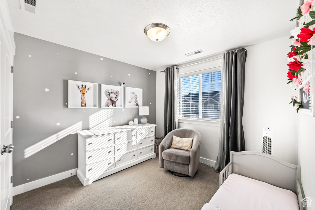 Carpeted bedroom with baseboards