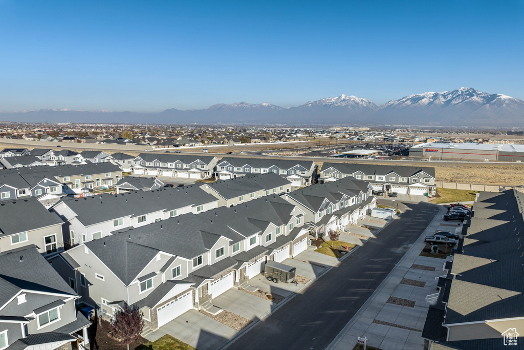 Aerial perspective of suburban area featuring a mountainous background