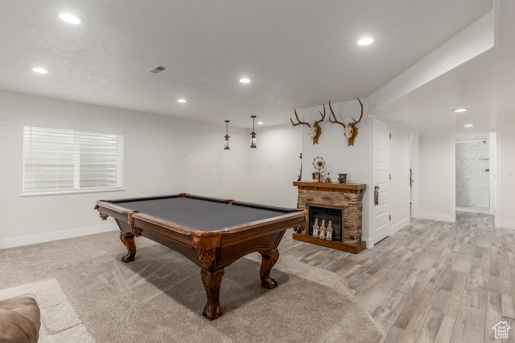 Recreation room featuring recessed lighting, baseboards, billiards, light wood finished floors, and a fireplace