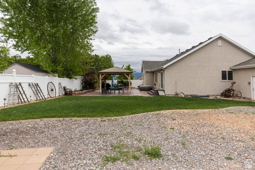 View of yard featuring a gazebo and a patio area