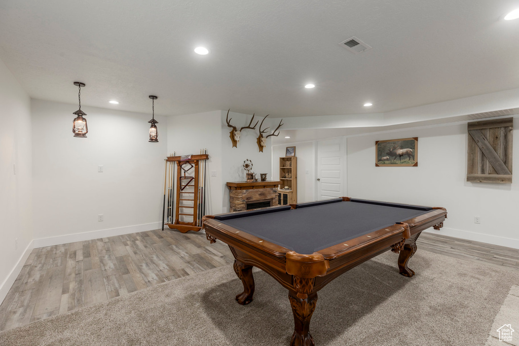 Recreation room featuring recessed lighting, baseboards, light wood finished floors, billiards table, and a fireplace