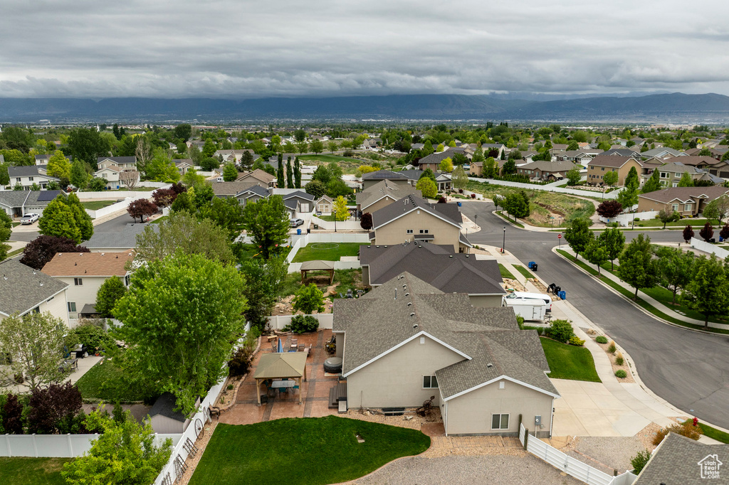Aerial view of residential area featuring mountains