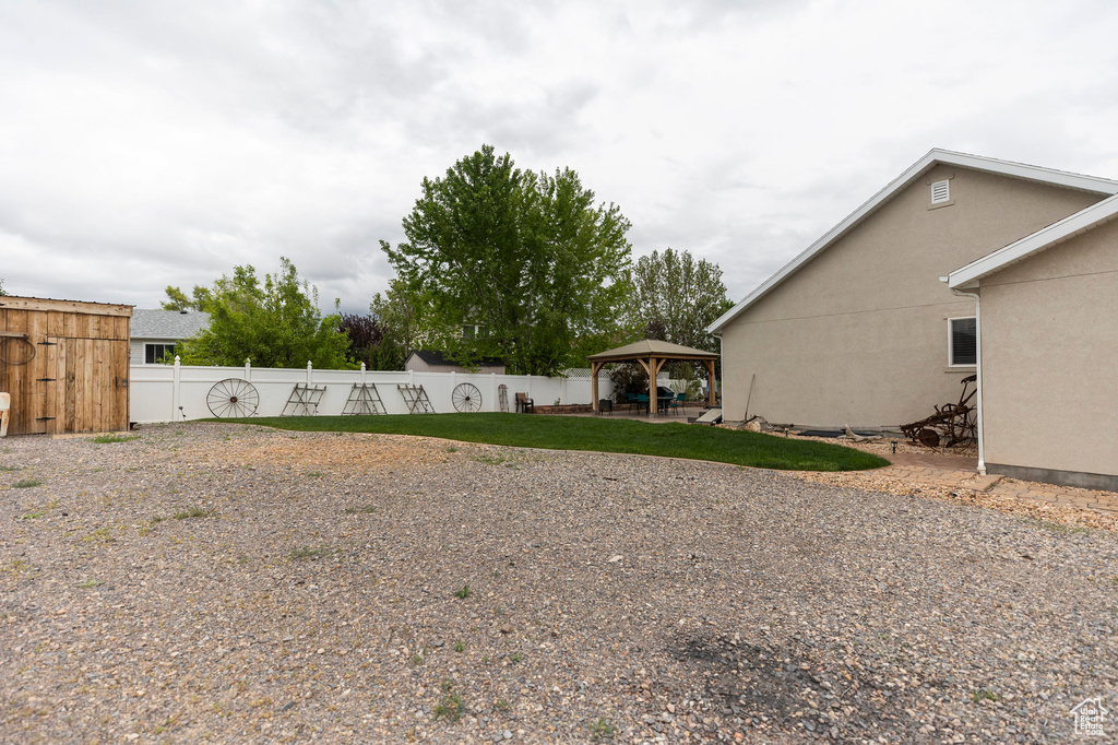 View of yard with a gazebo and fence