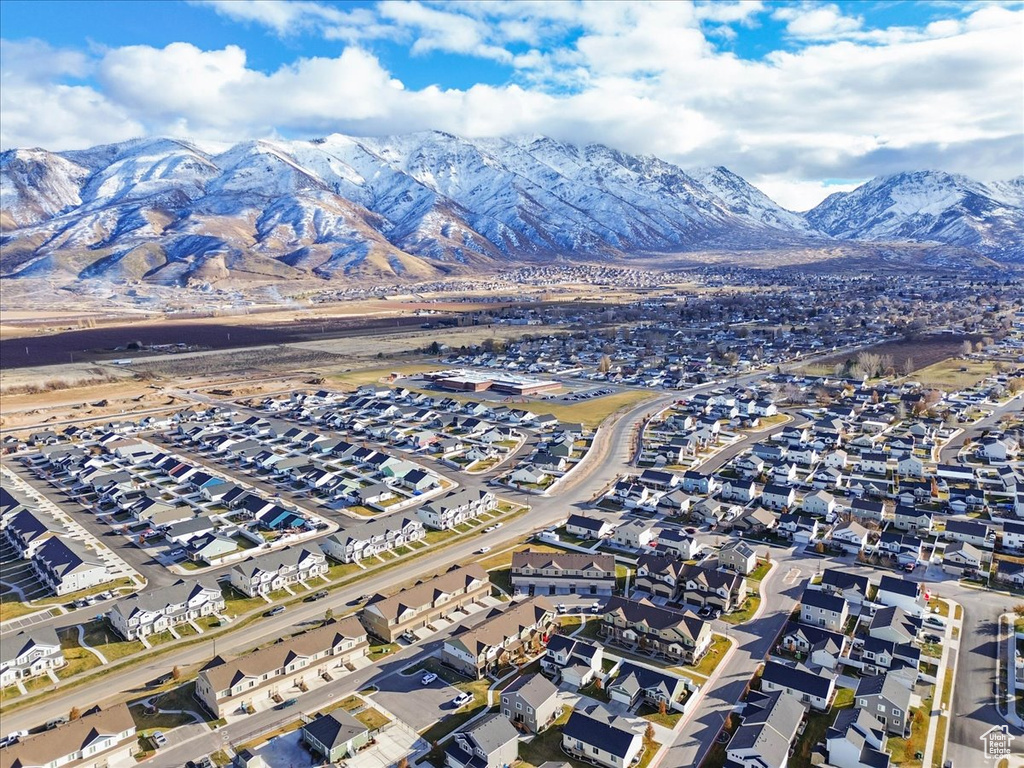 View of property location featuring mountains and nearby suburban area