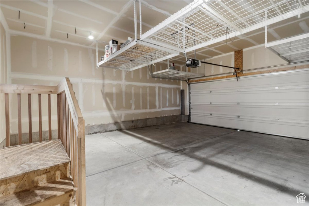 Garage featuring a garage door opener
