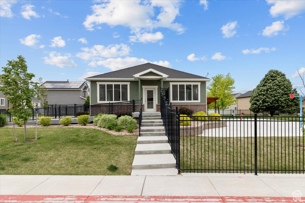 View of front of home featuring brick siding