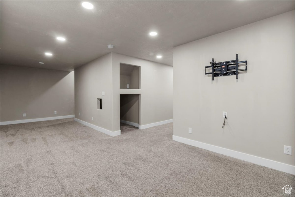 Finished basement featuring recessed lighting, carpet, and baseboards