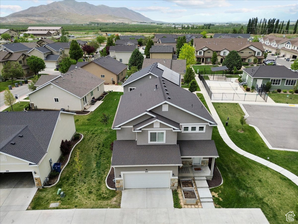 Aerial view of residential area featuring a mountain backdrop
