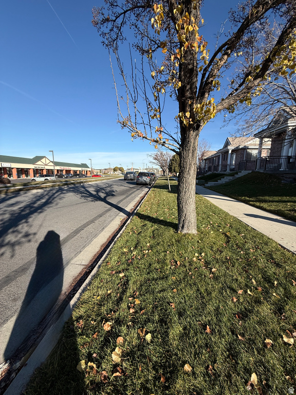 View of asphalt street with sidewalks