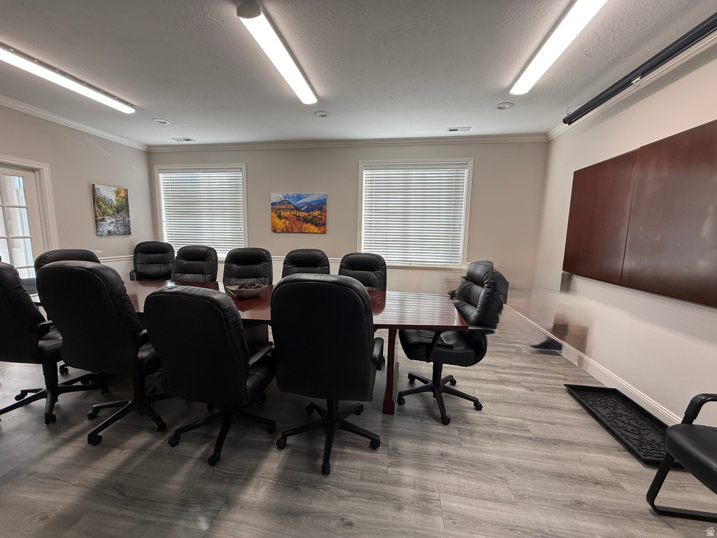 Office area featuring a textured ceiling and ornamental molding