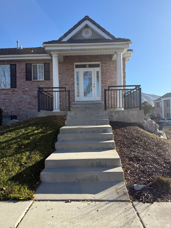View of front of house with brick siding