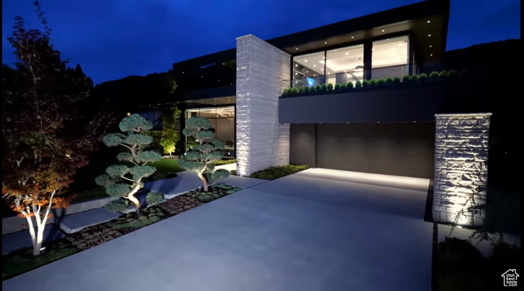 View of property exterior at night