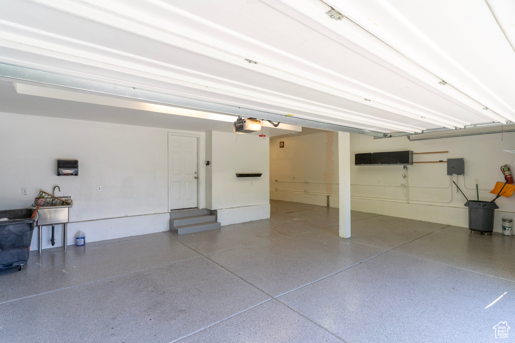 Garage featuring a garage door opener